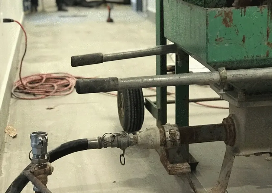 Pump and hoses set up for under-slab grouting