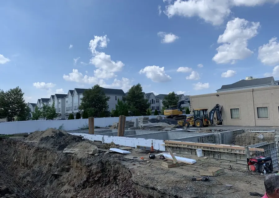 Poured foundation walls and excavation at a residential development